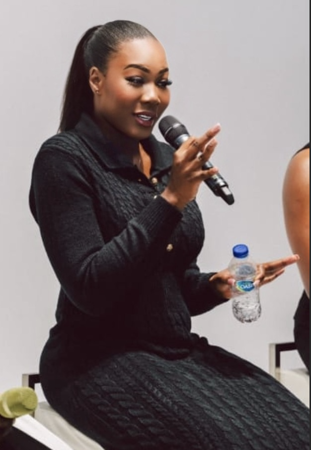 Meredith Shola speaking on a panel